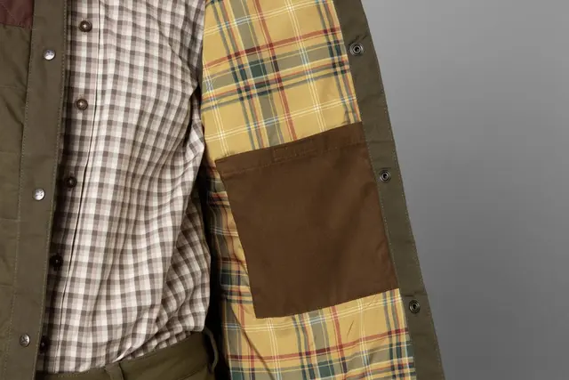 Härkila Retrieve Vest Olive/Burgundy 36 Slitesterk og vokset damevest 